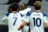 Tottenham's Moussa Sissoko, center, celebrates with Tottenham's Son Heung-min, center left, and Tottenham's Harry Kane, right, after scoring the opening goal during the EFL Cup semi-final soccer match between Tottenham Hotspur and Brentford at Tottenham Hotspur Stadium in London, England, Tuesday, Jan. 5, 2021. (Glyn Kirk/Pool via AP)