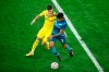 Dortmund's Thorgan Hazard, left, and Zenit's Wilmar Barrios fight for the ball during the Champions League group F soccer match between Zenit St.Petersburg and Borussia Dortmund at the Saint Petersburg stadium in St. Petersburg, Russia, Tuesday, Dec. 8, 2020. (AP Photo/Dmitri Lovetsky)
