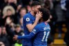 Chelsea's Olivier Giroud, left, celebrates with Chelsea's Willian after scoring his side's fourth goal during the English Premier League soccer match between Chelsea and Everton at Stamford Bridge stadium in London, Sunday, March 8, 2020. (AP Photo/Matt Dunham)