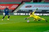 Arsenal's Alexandre Lacazette, left, scores his sides opening goal past Sheffield United's goalkeeper Aaron Ramsdale during an English Premier League soccer match between Sheffield United and Arsenal at the Bramall Lane stadium in Sheffield, England, Sunday, April 11, 2021. (AP Photo/Tim Keeton, Pool)