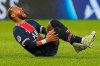PSG's Neymar falls in pain during the League One soccer match between Paris Saint Germain and Lyon, at the Parc des Princes stadium in Paris, France, Sunday, Dec. 13, 2020. (AP Photo/Thibault Camus)