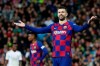 Barcelona's Gerard Pique reacts during the Spanish La Liga soccer match between Real Madrid and Barcelona at the Santiago Bernabeu stadium in Madrid, Spain, Sunday, March 1, 2020. (AP Photo/Manu Fernandez)