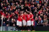 Manchester United's team players celebrate after Anthony Martial scored the opening goal during the English Premier League soccer match between Manchester United and Manchester City at Old Trafford in Manchester, England, Sunday, March 8, 2020. (AP Photo/Dave Thompson)