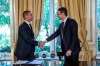 Greece's Prime Minister Kyriakos Mitsotakis, right, shakes hands with UEFA President Aleskander Ceferin, during their meeting in Athens, Tuesday, Feb. 25, 2020. Mitsotakis requested UEFA's help to clean up Greek soccer last month and has said he was willing to request expulsion of Greece's teams from European competition and even suspend the league unless major clubs sign up to a reform plan aimed stamping out match-related violence and widespread allegations of corruption in the sport. (AP Photo/Petros Giannakouris)