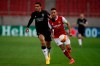 Benfica's Lucas Verissimo, left, runs for the ball in front of Arsenal's Pierre-Emerick Aubameyang during the Europa League round of 32, second leg, soccer match between Arsenal and Benfica at Georgios Karaiskakis stadium, in Piraeus port, near Athens, Thursday, Feb. 25, 2021. (AP Photo/Thanassis Stavrakis)