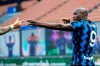 Inter Milan's Romelu Lukaku celebrates after scores against Sassuolo during the Serie A soccer match between Inter Milan and Sassuolo at the San Siro Stadium in Milan, Italy, Wednesday, April 7, 2021. (AP Photo/Antonio Calanni)