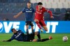 CORRECTS NAME OF LIVERPOOL PLAYER - Atalanta's Jose Luis Palomino, on the ground, fights for the ball with Liverpool's Curtis Jones during the Champions League, group D soccer match between Atalanta and Liverpool, at the Gewiss Stadium in Bergamo, Italy, Tuesday, Nov. 3, 2020. (AP Photo/Luca Bruno)