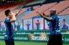 Inter Milan's Romelu Lukaku, right, celebrates with his teammate Lautaro Martinez after scores against Sassuolo during the Serie A soccer match between Inter Milan and Sassuolo at the San Siro Stadium in Milan, Italy, Wednesday, April 7, 2021. (AP Photo/Antonio Calanni)