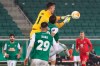 Molde's goalkeeper Andreas Linde, jumps for the ball by Rapid Wien's Maximilian Hofmann Fountas during the Europa League group B soccer match between SK Rapid Wien and Molde FKl at the Alianz Stadium in Vienna, Austria, Thursday, Dec. 10, 2020. (AP Photo/Ronald Zak)