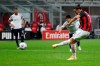 AC Milan's Zlatan Ibrahimovic scores with penalty against Bologna during the Serie A soccer match between AC Milan and Bologna at the San Siro stadium, in Milan, Italy, Monday, Sept. 21, 2020. (AP Photo/Antonio Calanni)