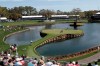 Cameron Champ, Nate Lashley, Kevin Tway and their caddies, walk the 17th green, during the first round of The Players Championship golf tournament Thursday, March 12, 2020 in Ponte Vedra Beach, Fla. (AP Photo/Lynne Sladky)