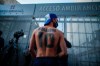 Soccer fans gather outside Clinica Olivos where former soccer star Diego Maradona will undergo surgery, in Buenos Aires, Argentina, Tuesday, Nov. 3, 2020. His personal doctor Leopoldo Luque, who is a neurologist, said Maradona has suffered a subdural hematoma, likely caused by an accident. The 1986 World Cup champion was admitted to a private hospital in la Plata with signs of depression on Monday, three days after his 60th birthday. (AP Photo/Natacha Pisarenko)