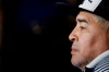 Gimnasia y Esgrima's coach Diego Maradona sits at the bench prior to an Argentina's soccer league match against Boca Juniors at La Bombonera stadium in Buenos Aires, Argentina, Saturday, March 7, 2020. (AP Photo/Natacha Pisarenko)