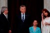 Outgoing president Mauricio Macri gestures before giving the presidential sash to new President Alberto Fernandez, left, at the Congress in Buenos Aires, Argentina, Tuesday, Dec. 10, 2019. At right is Vice President Cristina Fernandez de Kirchner. (AP Photo/Natacha Pisarenko)