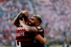 Gabriel of Brazil's Flamengo, right, celebrates with teammate Rhodolfo after winning the final of the Copa Libertadores final soccer match at the Monumental stadium in Lima, Peru, Saturday, Nov. 23, 2019. Gabriel scored his side's two goals against Argentina's River Plate. (AP Photo/Ernesto Arias)