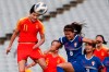 Wang Shanshan of China, left, goes up for a header against Taiwan's Wang Hsiang-Huei during their Olympic soccer qualifying match in Sydney, Friday, Feb. 10, 2020. (AP Photo/Steve Christo)