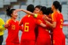 Wang Shanshan of China, center, reacts to scoring a goal with teammates against Thailand during their Olympic soccer qualifying match in Sydney, Friday, Feb. 7, 2020. (AP Photo/Steve Christo)