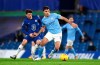 Chelsea's Mason Mount, left, and Manchester City's Rodrigo challenge for the ball during the English Premier League soccer match between Chelsea and Manchester City at Stamford Bridge, London, England, Sunday, Jan. 3, 2021. (Shaun Botterill/Pool via AP)