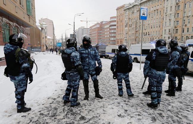 Police block a street before a protest against the jailing of opposition leader Alexei Navalny in Moscow, Russia, on Sunday, Jan. 31, 2021. Thousands of people took to the streets Sunday across Russia to demand the release of jailed opposition leader Alexei Navalny, keeping up the wave of nationwide protests that have rattled the Kremlin. Hundreds were detained by police. (AP Photo/Alexander Zemlianichenko)
