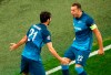 Zenit's Aleksandr Yerokhin, left, celebrates with teammate Artem Dzyuba after scoring his side's opening goal during the Champions League Group F soccer match between Zenit St.Petersburg and Lazio at the Saint Petersburg stadium in St. Petersburg, Russia, Wednesday, Nov. 4, 2020. (AP Photo/Mike Kireev)