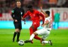Bayern's Alphonso Davies, centre, and Leipzig's Tyler Adams challenge for the ball during the German Bundesliga soccer match between Bayern Munich and RB Leipzig at the Allianz Arena in Munich, Germany, Sunday, Feb. 9, 2020. (AP Photo/Matthias Schrader)