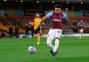 West Ham's Jesse Lingard scores his side's opening goal during the English Premier League soccer match between Wolverhampton Wanderers and West Ham United at Molineux Stadium in Wolverhampton, England, Monday, Apr. 5, 2021. (Laurence Griffiths/ Pool via AP)