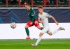 Lokomotiv's Daniil Kulikov, left, kicks the ball ahead of Bayern's Joshua Kimmich during the Champions League group A soccer match between Lokomotiv Moscow and Bayern Munich in Moscow, Russia, Tuesday, Oct. 27, 2020. (Maxim Shipenkov/Pool via AP)
