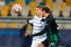 Dynamo Kyiv's Vladyslav Supriaha, left, and Ferencvaros' Lasha Dvali challenge for the ball during the Champions League Group G soccer match between Dynamo Kyiv and Ferencvaros at the Olimpiyskiy Stadium in Kyiv, Ukraine, Wednesday, Dec. 9, 2020. (AP Photo/Efrem Lukatsky)