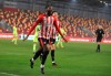 Brentford's Joshua Da Silva celebrates after scoring his side's opening goal during the EFL Cup soccer match between Brentford and Newcastle United at Brentford Community Stadium in London, England, Tuesday, Dec. 22, 2020. (Adam Davy/Pool via AP)