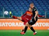 Roma's Gonzalo Villar, left, and Bologna's Valentin Anton challenge for the ball during the Italian Serie A soccer match between Roma and Bologna at Rome's Olympic stadium, Italy, Sunday, April 11, 2021. (AP Photo/Alessandra Tarantino)