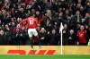 Manchester United's Marcus Rashford celebrates after scoring his side's second goal during the English Premier League soccer match between Manchester United and Tottenham Hotspur at Old Trafford in Manchester, England, Wednesday, Dec. 4, 2019. (AP Photo/Rui Vieira)