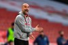 Manchester City's head coach Pep Guardiola reacts during the English Premier League soccer match between Arsenal and Manchester City at the Emirates stadium in London, England, Sunday, Feb. 21, 2021. (Shaun Botterill/Pool via AP)
