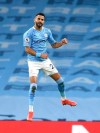Manchester City's Riyad Mahrez celebrates after scoring his side's second goal during the English Premier League soccer match between Manchester City and Southampton at the Etihad Stadium in Manchester, England, Wednesday, March 10, 2021. (Gareth Copley/Pool via AP)