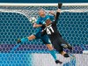 Zenit's Yaroslav Rakitskiy, left, and Zenit's goalkeeper Mikhail Kerzhakov in action during the Champions League group G soccer match between Zenit St. Petersburg and Lyon at the Saint Petersburg stadium in St. Petersburg, Russia, Wednesday, Nov. 27, 2019. (AP Photo/Dmitri Lovetsky)
