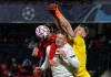 Krasnodar's goalkeeper Matvei Safonov, right, deflects the ball over Rennes' Adrien Hunou, left, and Krasnodar's Egor Sorokin during the Champions League, group E soccer match between Rennes and Krasnodar at the Roazhon Park stadium in Rennes, France, Tuesday, Oct. 20, 2020. (AP Photo/David Vincent)