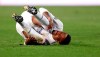 Real Madrid's Eder Militao lies on the pitch in pain during the Champions League, group B soccer match between Real Madrid and Shakhtar Donetsk at Alfredo di Stefano stadium in Madrid, Spain, Wednesday, Oct. 21, 2020. (AP Photo/Manu Fernandez)