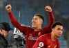 Liverpool's Roberto Firmino and Liverpool's Trent Alexander-Arnold celebrate their victory at the end of the English Premier League soccer match between Leicester City and Liverpool at the King Power Stadium in Leicester, England, Thursday, Dec. 26, 2019. (AP Photo/Rui Vieira)