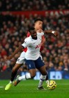 Tottenham's Tanguy Ndombele, left, and Manchester United's Mason Greenwood challenge for the ball during the English Premier League soccer match between Manchester United and Tottenham Hotspur at Old Trafford in Manchester, England, Wednesday, Dec. 4, 2019. (AP Photo/Rui Vieira)