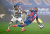 Manchester United's Fred, left, and Crystal Palace's Jordan Ayew challenge for the ball during the English Premier League soccer match between Crystal Palace and Manchester United at Selhurst Park stadium in London, England, Wednesday, March 3, 2021. (Mike Hewitt/Pool via AP)