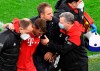 Bayern's head coach Hans-Dieter Flick, centre, follows injured Bayern's Joshua Kimmich during the German Bundesliga soccer match between Borussia Dortmund and Bayern Munich in Dortmund, Germany, Saturday, Nov. 7, 2020. (AP Photo/Martin Meissner, Pool)