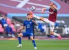 West Ham's Tomas Soucek, right, kicks the ball ahead of Chelsea's Christian Pulisic during the English Premier League soccer match between West Ham United and Chelsea at London Stadium, London, England, Saturday, April 24, 2021. (Justin Setterfield/Pool via AP)