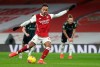 Arsenal's Pierre-Emerick Aubameyang shoots to score from the penalty spot during the English Premier League soccer match between Arsenal and Leeds United at the Emirates stadium in London, England, Sunday, Feb. 14, 2021. (Catherine Ivill/Pool via AP)