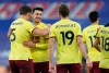 Burnley's Matthew Lowton celebrates with James Tarkowski and Jay Rodriguez after the English Premier League soccer match between Crystal Palace and Burnley at Selhurst Park stadium in London, England, Saturday, Feb. 13, 2021. (John Walton/Pool via AP)