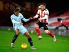 Chelsea's Reece James, left, and Sheffield United's John Fleck challenge for the ball during the English Premier League soccer match between Sheffield United and Chelsea at Bramall Lane stadium in Sheffield, England, Sunday, Feb. 7, 2021. (Clive Mason/ Pool via AP)