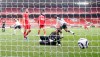 Liverpool's goalkeeper Alisson fails to save the goal from Fulham's Mario Lemina during the English Premier League soccer match between Liverpool and Fulham at Anfield stadium in Liverpool, England, Sunday, March 7, 2021. (Phil Noble/Pool via AP)
