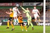 Leeds United's Pascal Struijk, second left, and Wolverhampton Wanderers' goalkeeper Rui Patricio, second right, challenge for the ball during the English Premier League soccer match between Wolverhampton Wanderers and Leeds United at the Molineux Stadium in Wolverhampton, England, Friday, Feb. 19, 2021. (Alex Pantling/Pool via AP)
