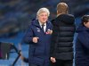 Brighton's head coach Graham Potter, right, and Crystal Palace's manager Roy Hodgson cheer each other after the English Premier League soccer match between Brighton and Hove Albion and Crystal Palace at the Falmer stadium in Brighton, England, Monday, Feb. 22, 2021. (AP Photo/Frank Augstein, Pool)