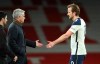 Tottenham Hotspur manager Jose Mourinho greets Harry Kane after the final whistle during the English Premier League soccer match between Arsenal and Tottenham Hotspur at the Emirates stadium in London, England, Sunday, March 14, 2021. (Nick Potts/Pool via AP)
