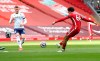 Liverpool's Trent Alexander-Arnold scores his side's second goal during the English Premier League soccer match between Liverpool and Aston Villa at Anfield stadium in Liverpool, England, Saturday, April 10, 2021. (Martin Rickett/Pool via AP)