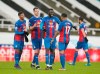 Crystal Palace players celebrate at the end of the English Premier League soccer match between Newcastle United and Crystal Palace at St. James' Park in Newcastle, England, Tuesday, Feb. 2, 2021. (Jon Super/Pool via AP)
